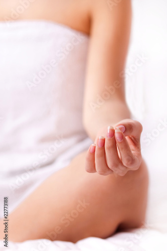 Fototapeta Naklejka Na Ścianę i Meble -  Close up shot of a young woman fingers while doing yoga