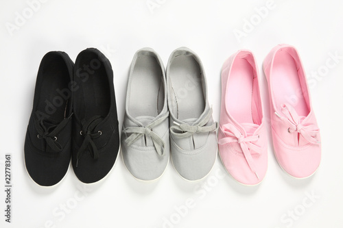 grey ,pink and black women shoes with white background