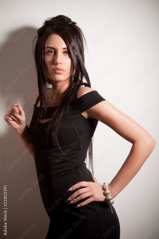 Attractive brunette girl in fashion black dress Attractive brunette girl in fashion black dress
