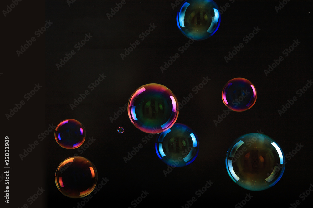 Soap bubbles on black background . Soap bubbles on black background .