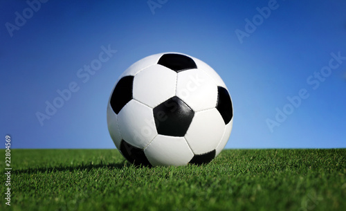 Photo of a soccer ball on grass © Mikael Damkier