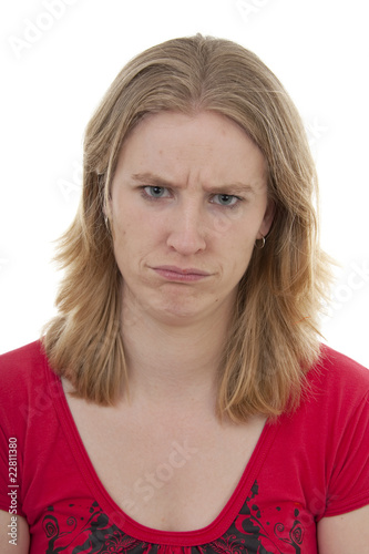 Woman looks angry over white background