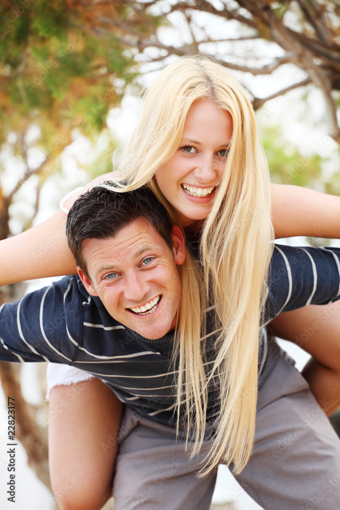 Young happy couple. Shallow DoF with focus on the man. Young happy couple. Shallow DoF with focus on the man.