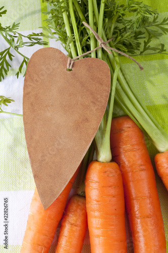 I love carrot, fresh carrots with leaves and paper heart photo