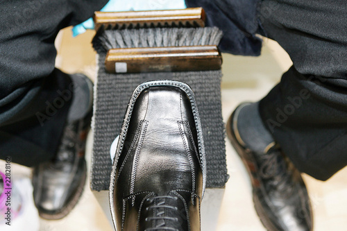 shoeshine boy at work photo