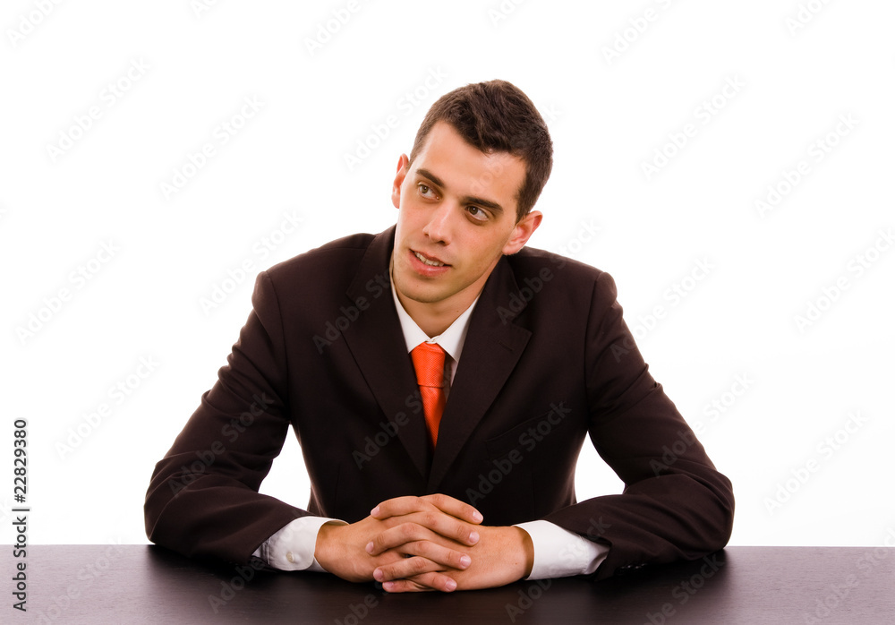 Pensive businessman on a desk at the office