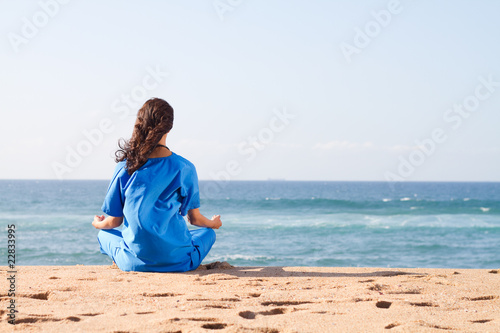 nurse meditating on beach