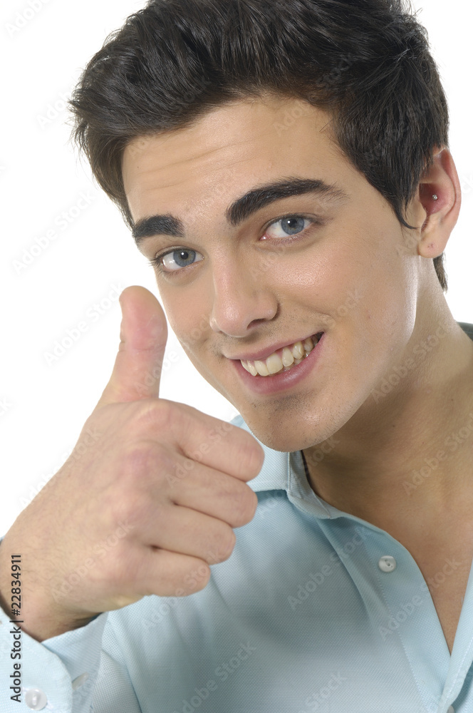 Handsome young man with thumbs up on an isolated Handsome young man with thumbs up on an isolated