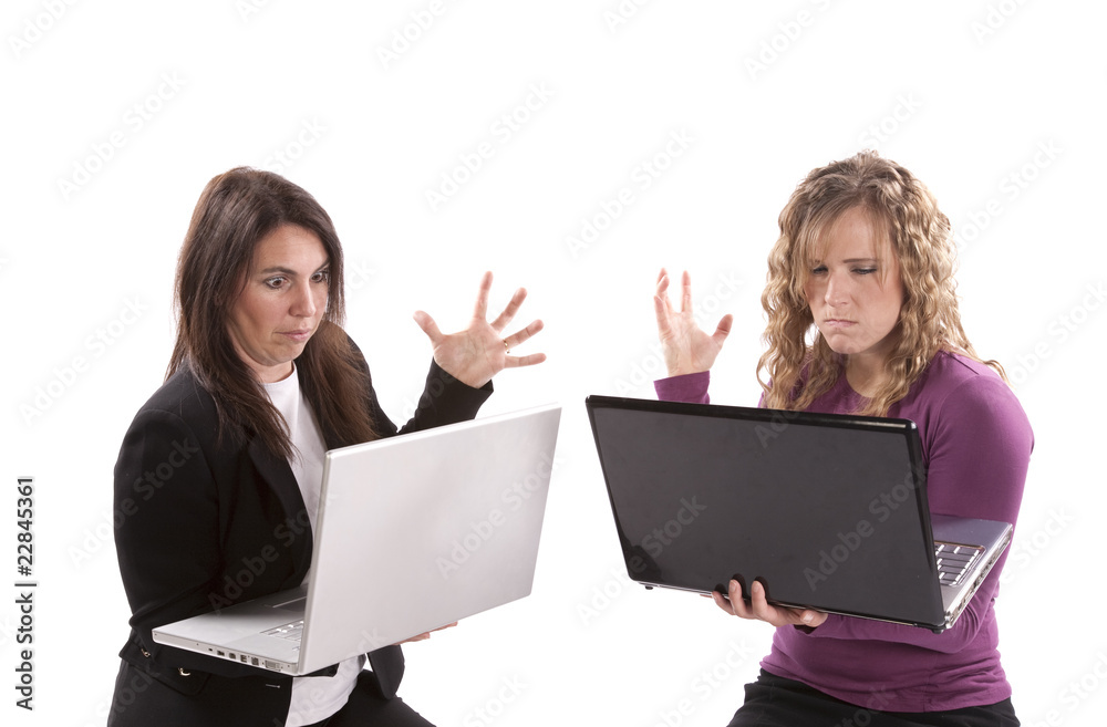 Women with laptops looking frustrated Women with laptops looking frustrated