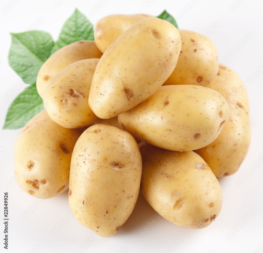 Yellow potatoes with leaves on a white background Yellow potatoes with leaves on a white background