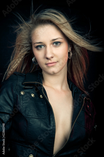 Beautiful girl in a leather jacket