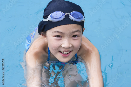 little asian girl in swimming pool