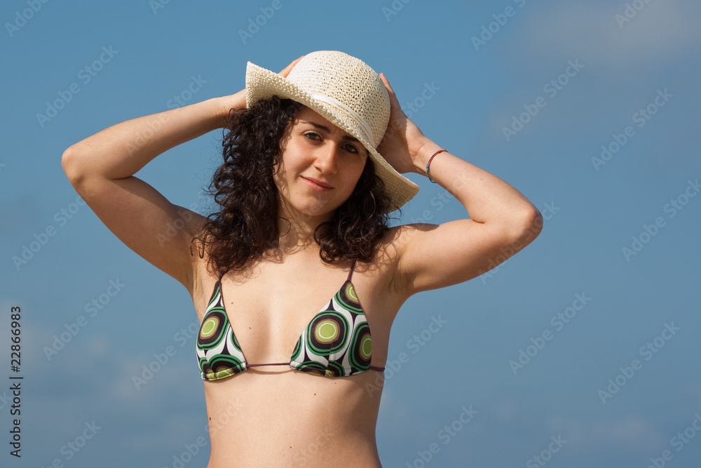 young woman wearing swimsuit at the seaside
