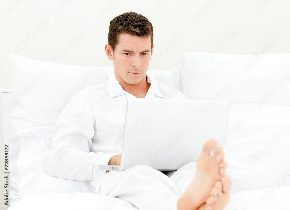 Handsome man sitting on the sofa Handsome man sitting on the sofa