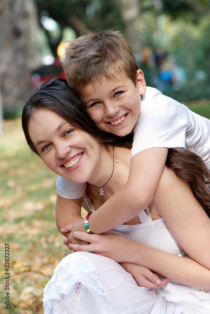 Happy mother and son in a park Happy mother and son in a park