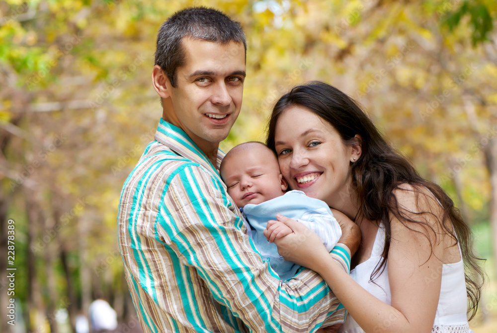 family with baby in  in autumn park