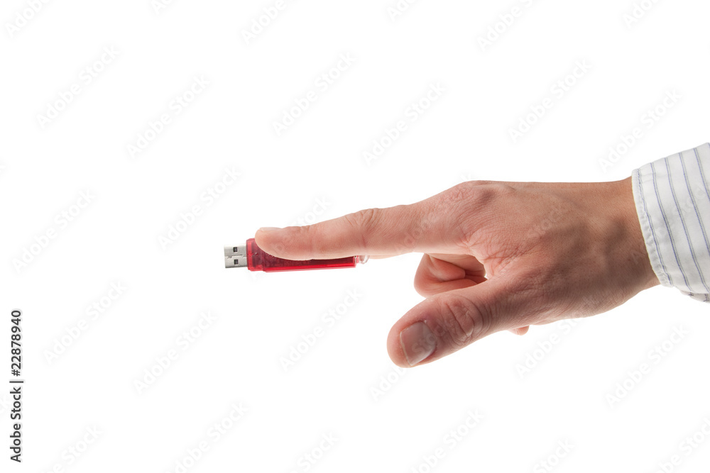 hand in business shirt holding an USB stick hand in business shirt holding an USB stick