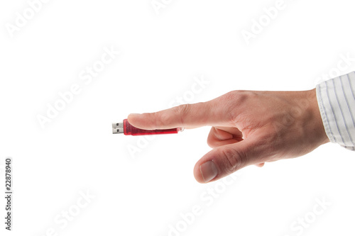 hand in business shirt holding an USB stick