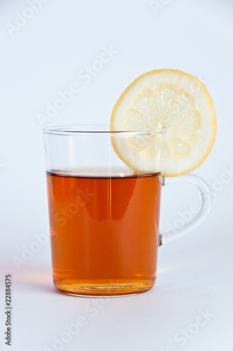 Glass of hot black tea with lemon