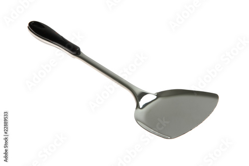 Kitchen utensil - stainless spatula isolated on white .