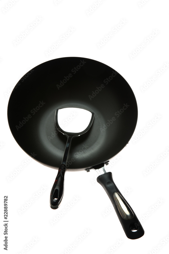 stainless spatula in fry pan on a white background stainless spatula in fry pan on a white background