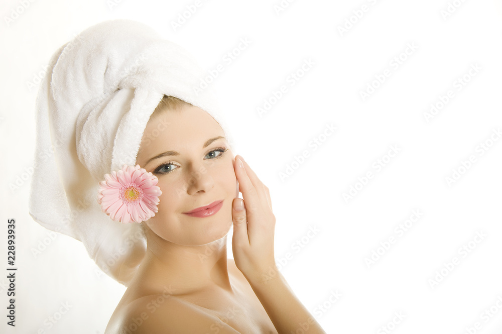 Young beautiful woman with healthy pure skin and pink flower Young beautiful woman with healthy pure skin and pink flower