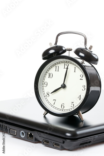 alarm clock and laptop