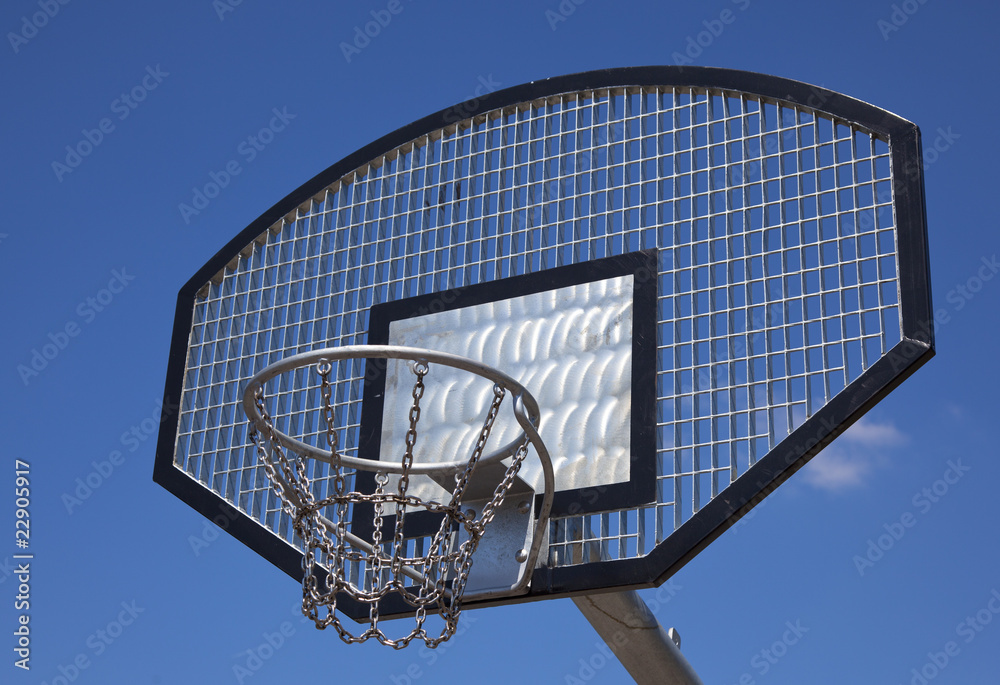 a basketball basket with blue sky