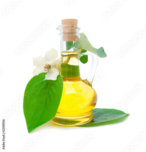 Jug with and a beautiful white flower on a branch