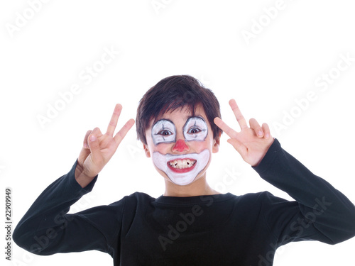smiling boy flashing peace sign isolated on white background
