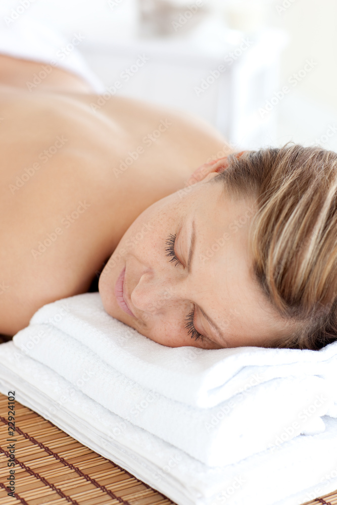 Portrait of a teen woman having a massage with stones Portrait of a teen woman having a massage with stones