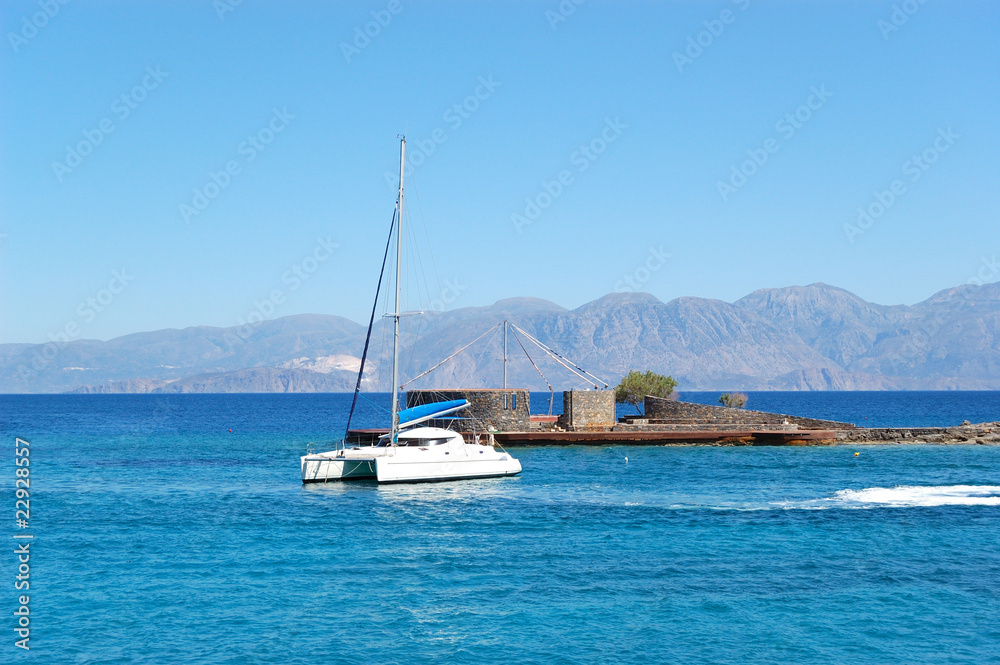Turquoise Aegean Sea and luxury yacht, Crete, Greece