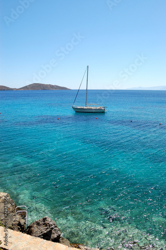Turquoise Aegean Sea and yacht, Crete, Greece