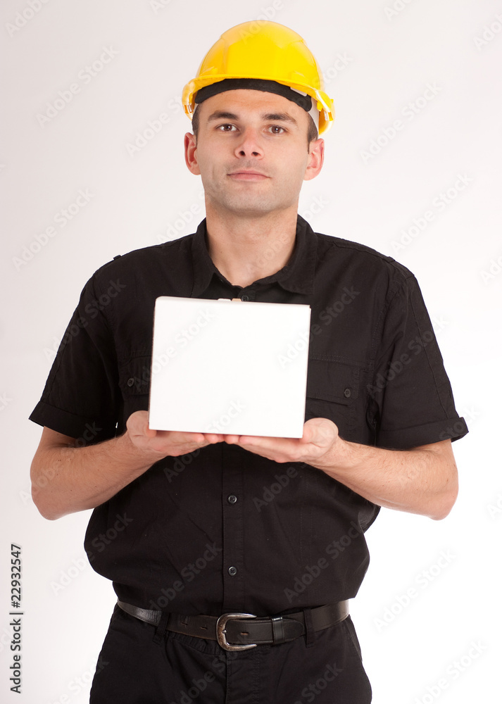 Man with safety helmet holding a white box Man with safety helmet holding a white box