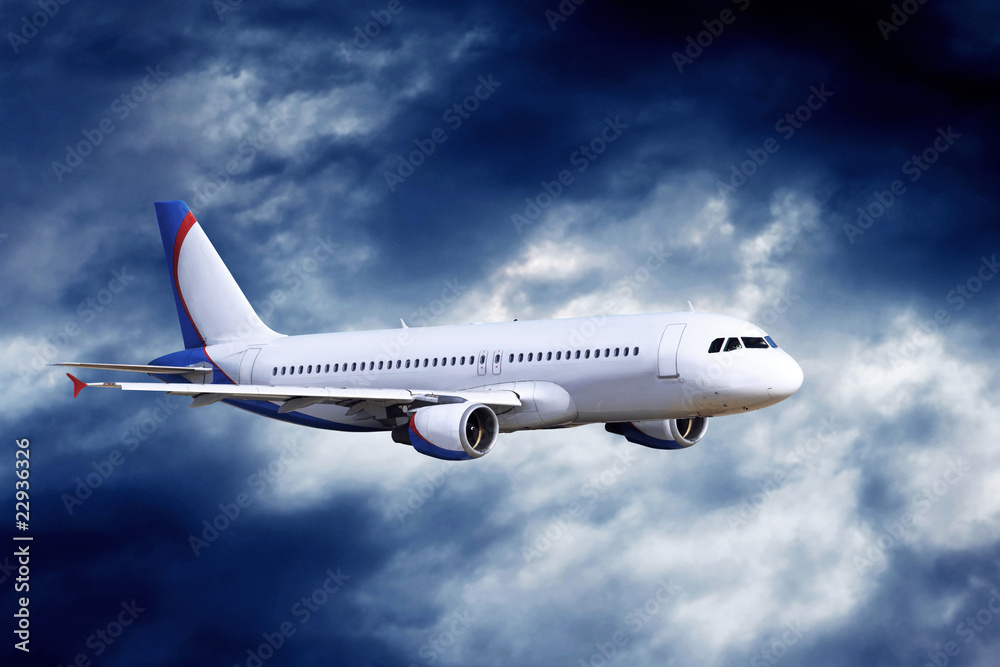 Obraz premium Airplane at fly on the sky with clouds