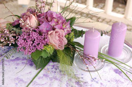 Violet wedding decoration with flowers and candles