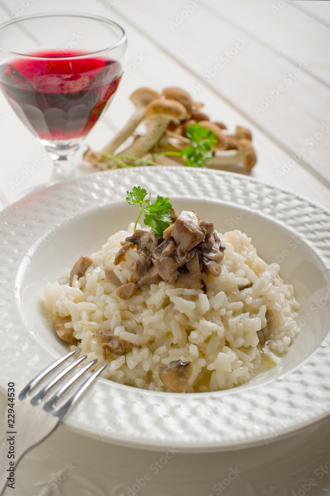 mushroom rice over dish with red wine -riso ai funghi