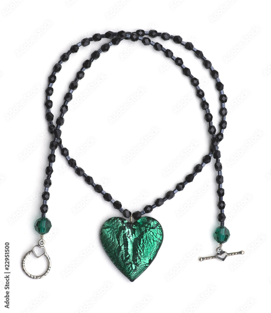 Crystal glass green beads & black heart necklace, isolated Crystal glass green beads & black heart necklace, isolated