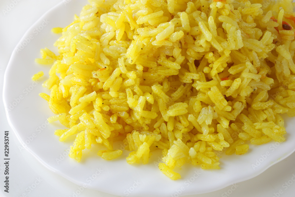 Cooked rice with turmetic in plate Cooked rice with turmetic in plate