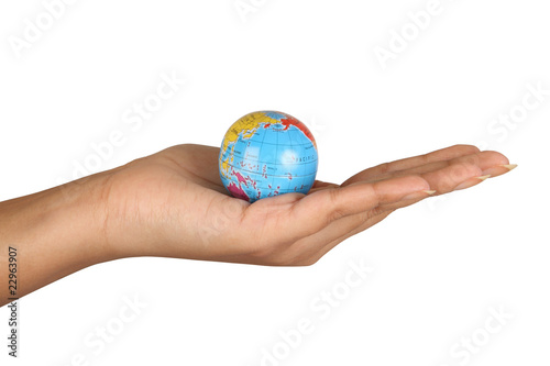 Female hand holding a globe