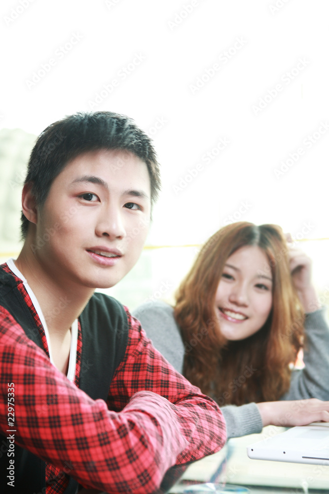 couple of asian using laptop in classroom couple of asian using laptop in classroom