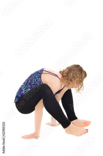 Young girl excercise on isolated background