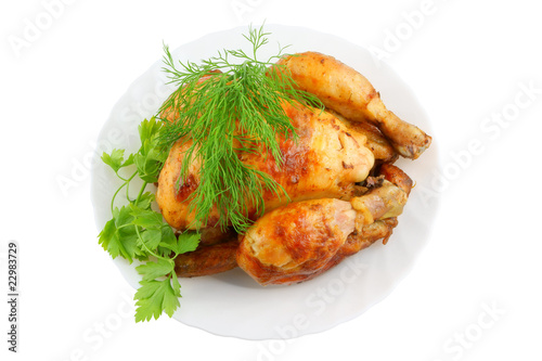 Grilled chicken with greens on plate isolated