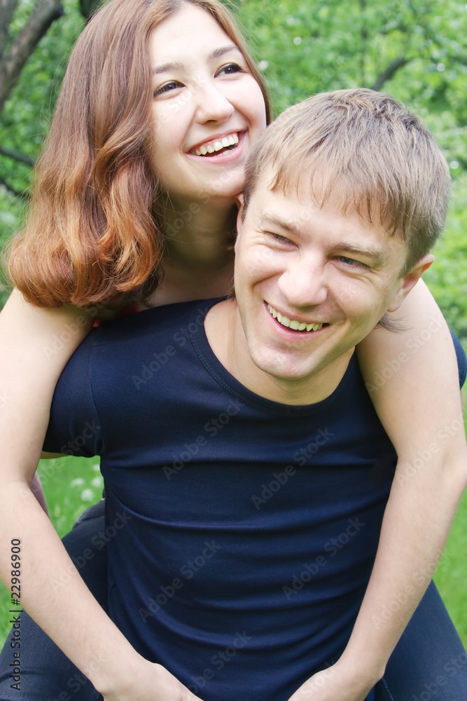A young pair, manipulating in nature, - a front view A young pair, manipulating in nature, - a front view