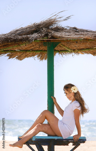 young beautiful woman relaxing on beach