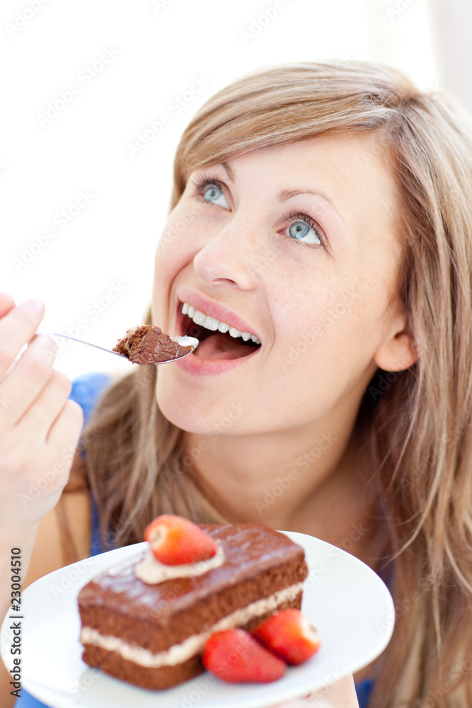 Delighted woman holding a piece of chocolate cake Delighted woman holding a piece of chocolate cake