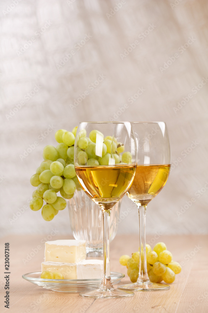 Still-life with bunch of grapes and white wine