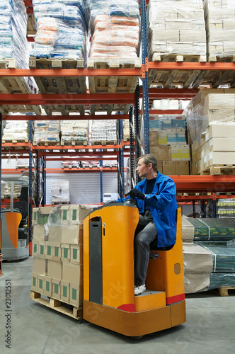 Fotografie order picker loader in warehouse