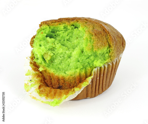 Pistachio nut muffin that has had one bite