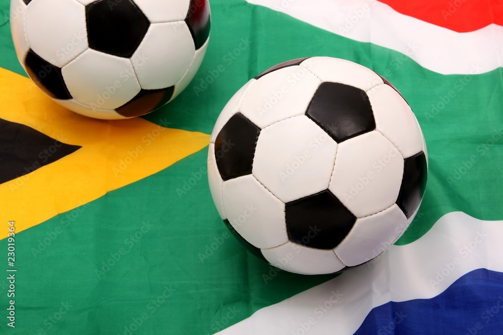 Obraz premium soccer balls on south africa flag